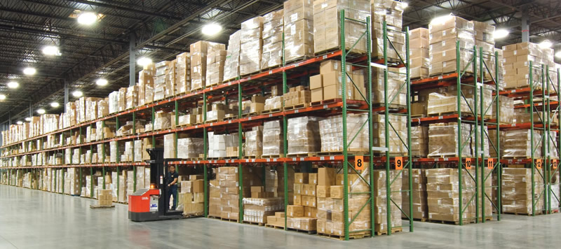 Pallet rack rows and warehouse handling aisles